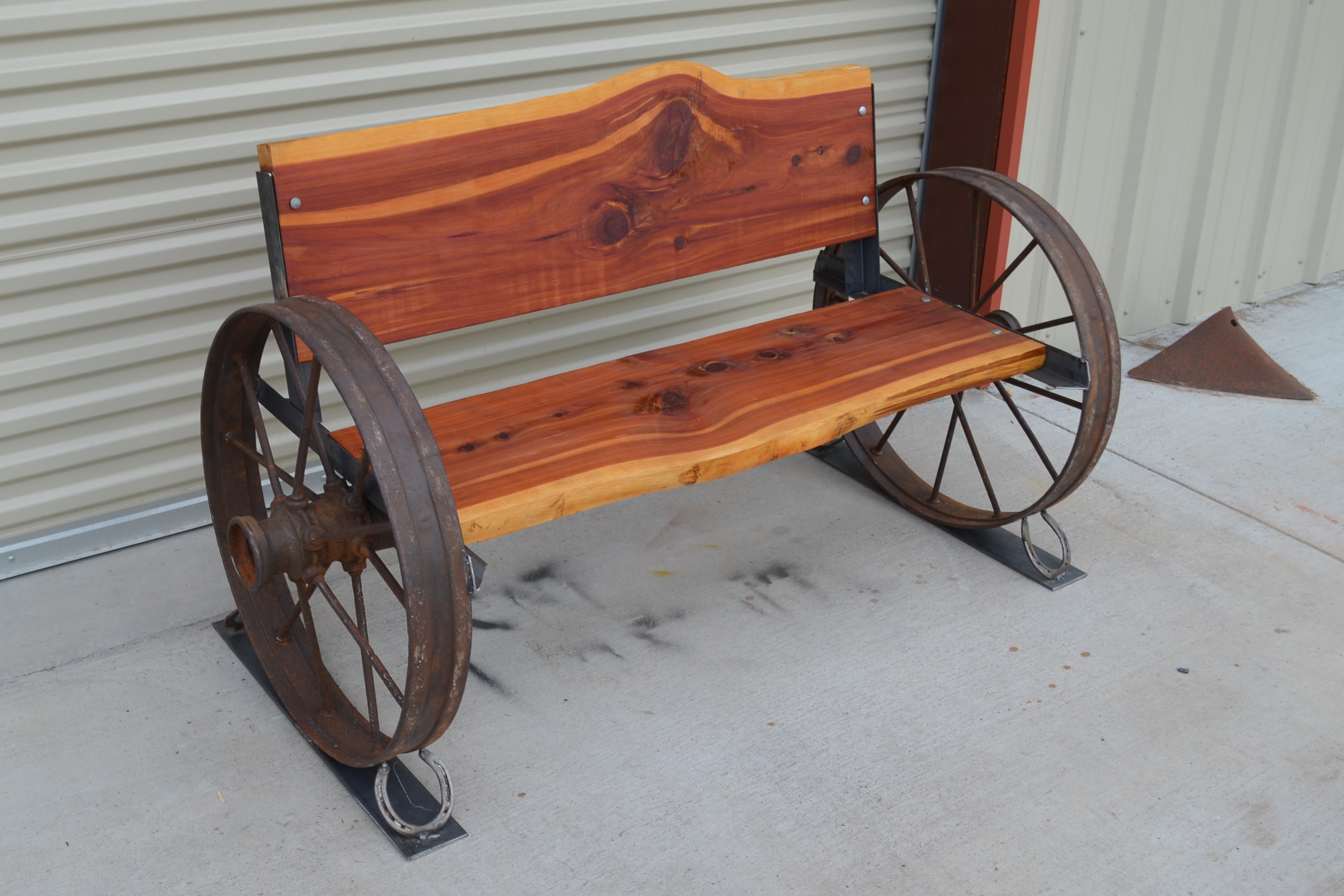 Check Out Our New Cedar Benches with Antique Wagon Wheels